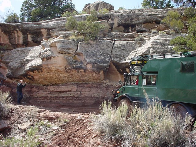 under the overhang.